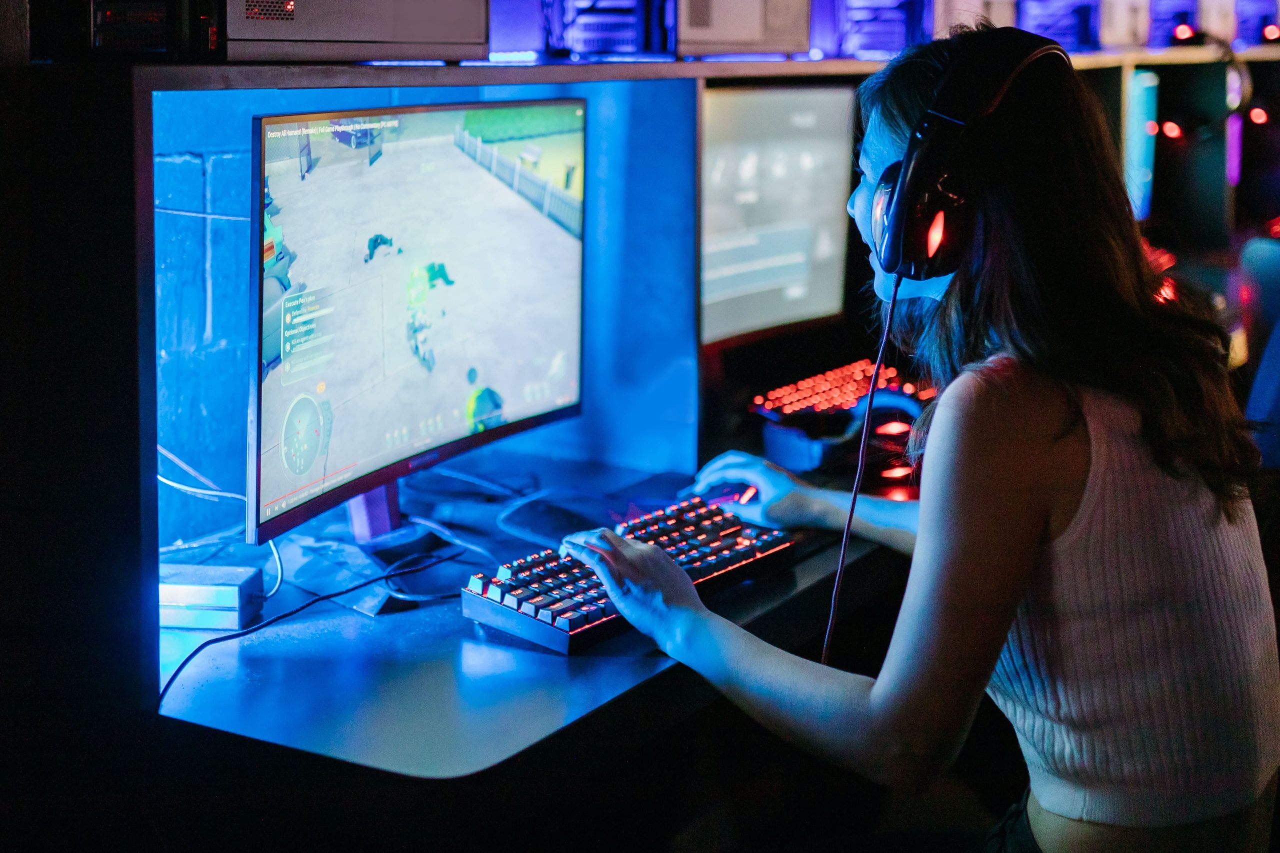 girl in front of screen gaming on PC